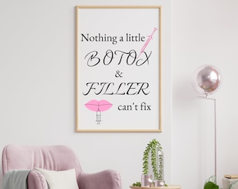 May include: A framed print with the text "Nothing a little BOTOX & FILLER can't fix" in black cursive font. A pink lip with a needle is below the text. The background is white.