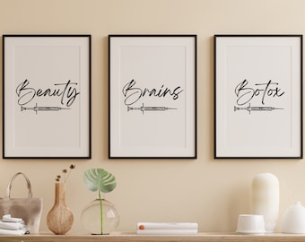 May include: Three black framed prints with white backgrounds. Each print features a syringe with a black outline and the words "Beauty", "Brains", and "Botox" written in black cursive.