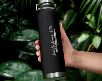 May include: Black stainless steel water bottle with a white design that says "beauty, brains, botox" and a syringe graphic.