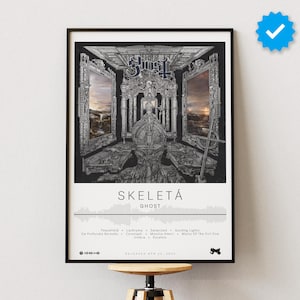 May include: A black and white framed poster with the album art for "Skeletå" by Ghost. The album art features a black and white image of a room with a throne in the center. The album title "Skeletå" and the band name "Ghost" are printed in white below the image. The tracklist is printed below the band name.