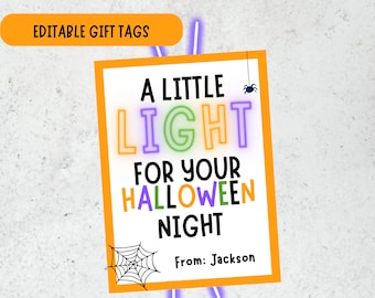 May include: A rectangular Halloween gift tag with an orange border on a white background. The text reads A LITTLE LIGHT FOR YOUR HALLOWEEN NIGHT in colourful letters, with a small spider, a spider web, and the text From: Jackson at the bottom.