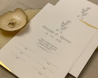 May include: A white wedding invitation with gold accents and a simple floral design. The invitation includes the names Rüveyda & Alperen and the date 21/04/2021. The text "Allah sevdiği kulunun kalbini, sevdiği kulunun kalbiyle birleştirir. Hz. Muhammed (s.a.c)" is also included.