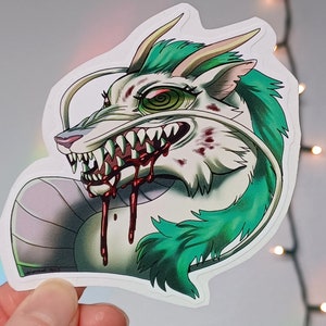 May include: A white dragon with green hair and a white horn is shown with its mouth open, revealing sharp teeth and dripping blood. The dragon has a white and purple body with a green and white tail.