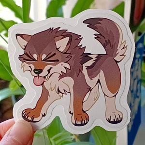 May include: A brown and white cartoon wolf with a pink tongue sticking out. The wolf is looking to the left and has a mischievous expression on its face. The wolf is drawn in a cute, stylized manner.