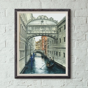 May include: A watercolor painting of a canal in Venice, Italy. The painting shows a gondola with a gondolier rowing down the canal. The Rialto Bridge is visible in the background.