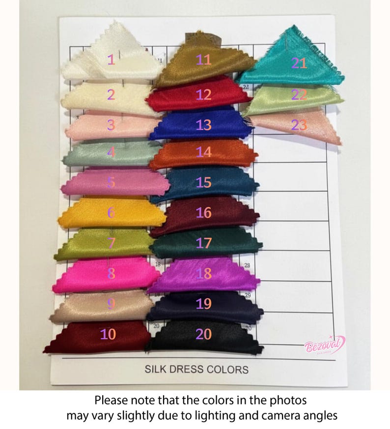 May include: A color chart displaying samples of silk dress fabric in various shades. The samples are arranged in rows and columns, with each color labeled with a number. The chart includes colors such as cream, gold, red, blue, orange, and teal. The text "SILK DRESS COLORS" is visible.