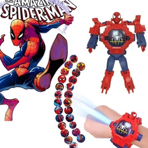 May include: A red and blue transforming Spider-Man watch with a projector that displays images of Spider-Man. The watch has a red wristband and a black face with a Spider-Man logo. The watch transforms into a robot with red and blue arms and legs.