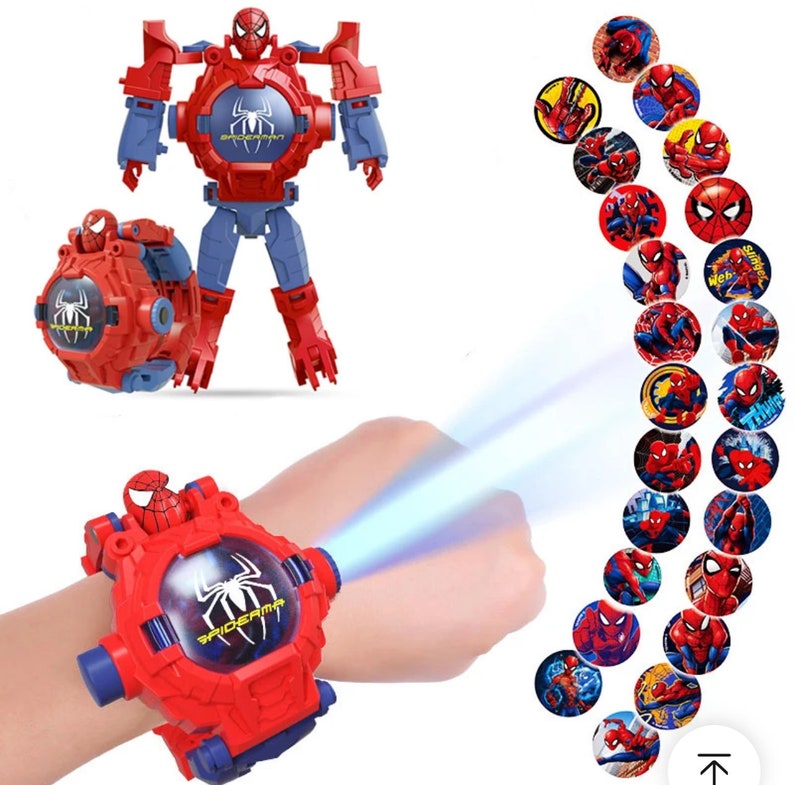 May include: Red and blue plastic toy watch with a Spiderman character on the face. The watch transforms into a robot and projects images of Spiderman.