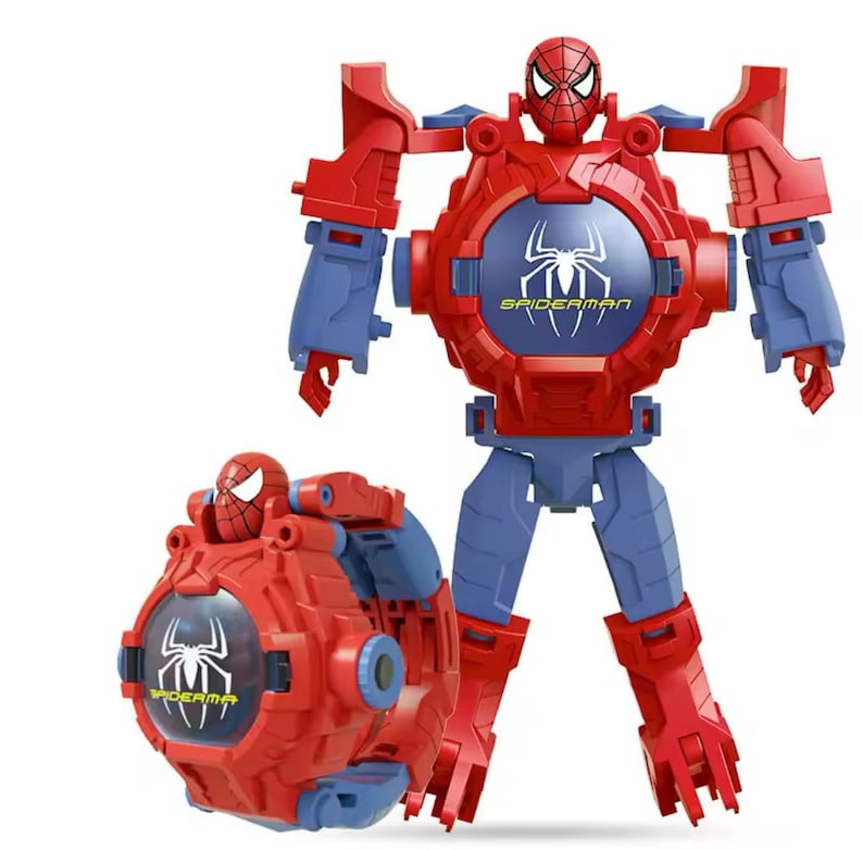 May include: A red and blue transforming robot toy featuring Spiderman. The robot is in a standing position with its arms outstretched. The robot's head is a watch with a Spiderman logo on the face. The toy is in a partially transformed state, with the watch portion of the robot detached and lying on the ground.