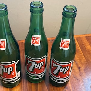7 UP Glass Bottles circa 1960s , Vintage Pop Bottles, Green Glass Bottles with Orange and White Labels.