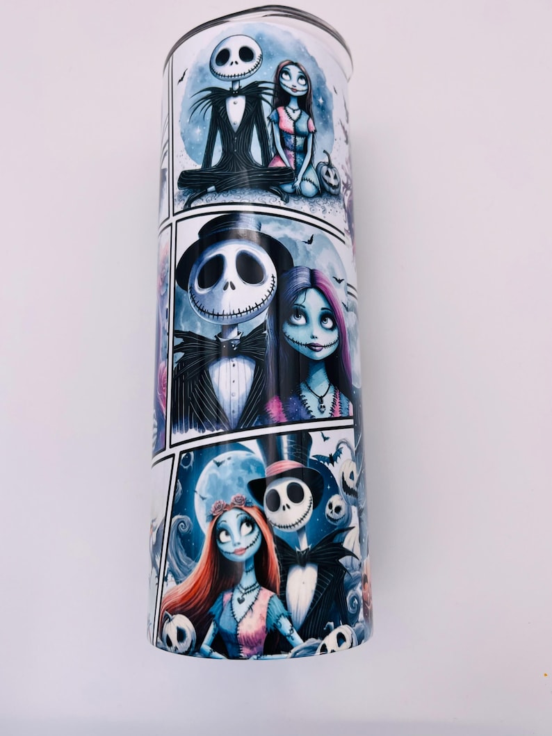 May include: A white stainless steel tumbler with a colorful graphic print of Jack Skellington and Sally from the Nightmare Before Christmas movie. The print features multiple scenes of the couple in different poses.