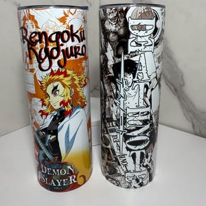 May include: Two stainless steel tumblers with anime-themed designs. One features "Rengoku Kyojuro" and a character illustration from "Demon Slayer." The other has a black and white manga-style design with the text "Death Note."