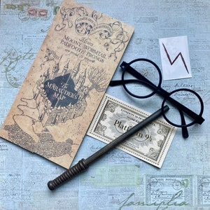May include: A collection of Harry Potter-themed items, including a replica of the Marauder's Map, round black glasses, a wand, a Platform 9 3/4 ticket, and a lightning bolt symbol. The items are arranged on a vintage-style background.