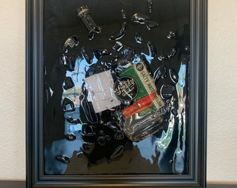 Arte de resina con botella de whisky rota