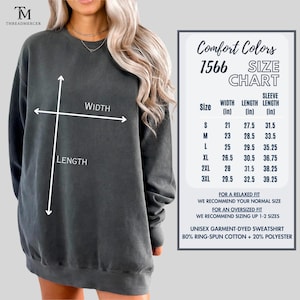 May include: Dark gray unisex garment-dyed sweatshirt with a size chart. The chart shows measurements in inches for width, length, and sleeve length. The sweatshirt is made of 80% ring-spun cotton and 20% polyester.
