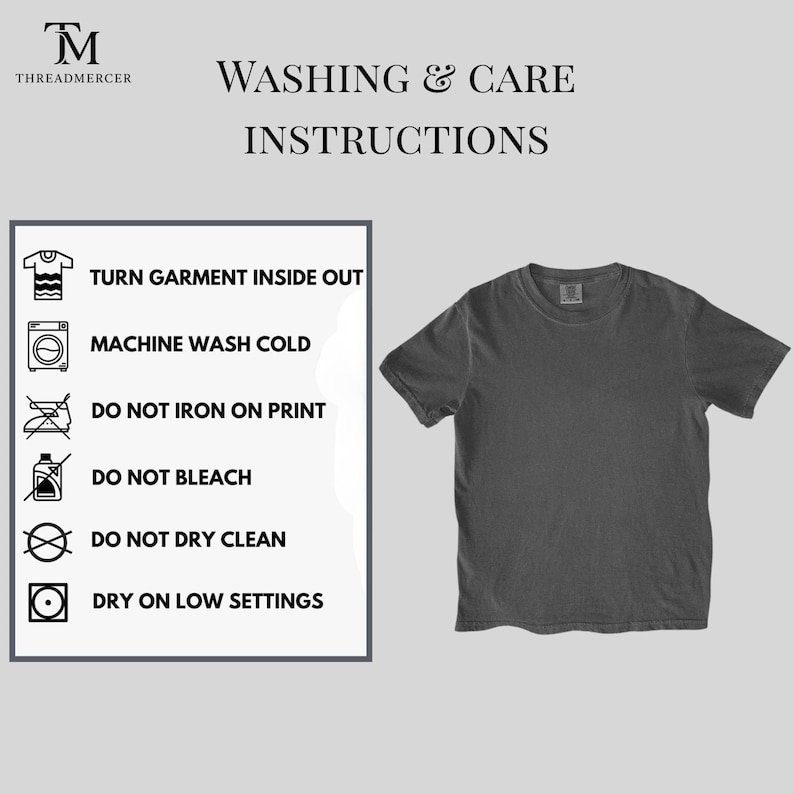 May include: A dark gray t-shirt next to a panel with washing and care instructions. The instructions include turning the garment inside out, machine washing cold, and avoiding ironing on the print, bleaching, and dry cleaning. The shirt has a crew neck.