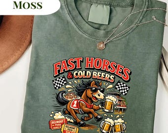 May include: Moss green t-shirt with a graphic of a horse wearing sunglasses and holding beer mugs. The text "FAST HORSES & COLD BEERS" is in red and white. Includes Belmont Park tickets.