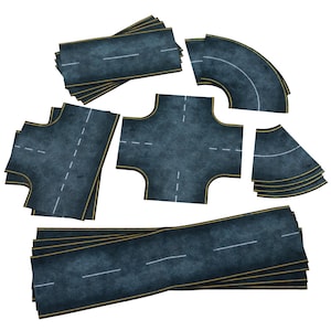May include: A collection of dark gray road pieces with white lane markings and yellow edge lines. The set includes straight, curved, and intersection pieces, suitable for creating a miniature road network for toy cars or model displays.