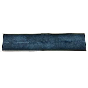 May include: A rectangular, dark blue road mat with white lane markings and yellow edge lines. The mat is designed to resemble a section of asphalt road, suitable for toy cars or model displays.