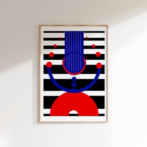May include: Abstract art print featuring a geometric design in a wooden frame. The artwork showcases a combination of red, blue, and black shapes against a backdrop of black and white horizontal stripes. The composition includes circles, arcs, and vertical lines.