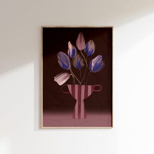 May include: A framed print of a stylized illustration of a bouquet of purple and pink flowers in a striped red and white vase on a dark red background.