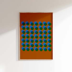 May include: A framed print with a geometric pattern of overlapping blue and green circles on a brown background.