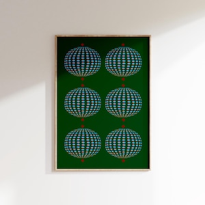 May include: A framed print featuring a green background with six blue and gold spheres, each with a red dot at its centre.