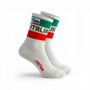 May include: Pair of white athletic socks featuring green, red, and white stripes, and the word "ITALIA" in yellow. The socks have the text "Pro'line" in red.
