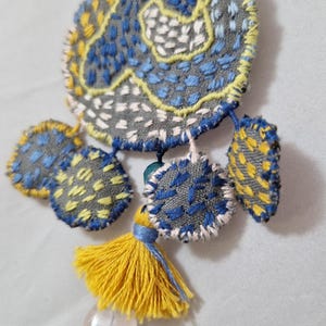 Hand-embroidered silk brooch, textile jewelry with tassel and bead
