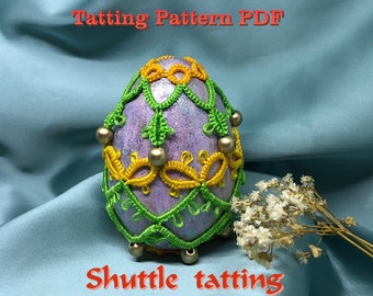 May include: A purple egg decorated with green and yellow shuttle tatting. The text "Tatting Pattern PDF" and "Shuttle tatting" is visible in the image.