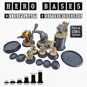 May include: A collection of black display bases and extenders for miniature figures. The image includes various sizes and shapes, with text indicating heights from 9mm to 82mm. The text "HERO BASES DISPLAY EXTENDERS" is displayed at the top.