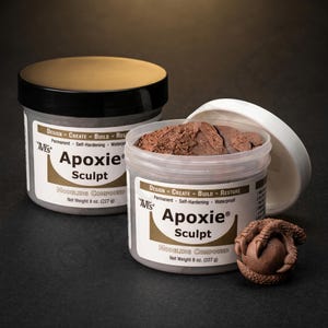 May include: Two containers of Apoxie Sculpt modeling compound. One container is closed with a gold lid, the other is open, revealing brown sculpting material. The label reads "Apoxie Sculpt" and "Net Weight 8 oz. (227 g)". A brown sculpted claw is next to the open container.