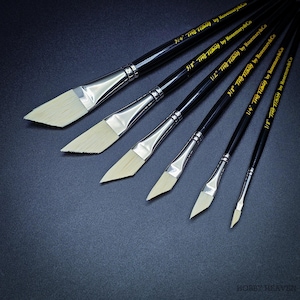 May include: A set of six angled paint brushes with black handles and silver ferrules. The bristles are off-white. Each brush is labeled with its size and "THE Tracy by Rosemary&Co". The brushes are arranged on a dark blue surface.