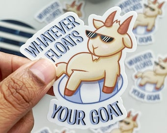 May include: A white sticker with a cartoon goat wearing sunglasses and a blue inflatable ring. The text "Whatever Floats Your Goat" is written in blue letters.