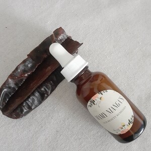 May include: A brown glass bottle with a white dropper and a white label that says "Many Mango's Skin Beauty Remedies".
