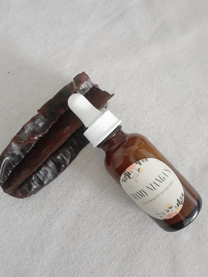 May include: A brown glass bottle with a white dropper and a white label that says "Many Mango's Skin Beauty Remedies".