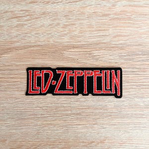 May include: Red "LED ZEPPELIN" text on a black patch with white stitching.