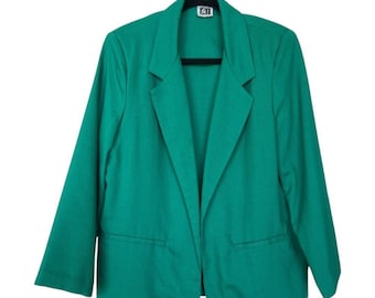 May include: A green blazer with a long sleeve and a single pocket on each side. The blazer has a collar and a single button closure.