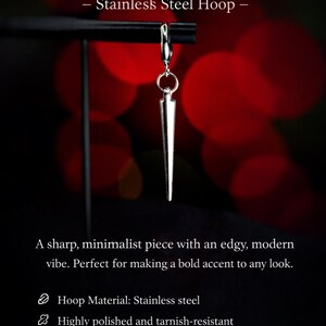 Puede incluir: Un pendiente colgante de punta de acero inoxidable. Dise&ntilde;o minimalista y elegante. El texto de la imagen dice "Sleek Spike Drop Earring - Stainless Steel Hoop -" y es de dise&ntilde;o unisex.