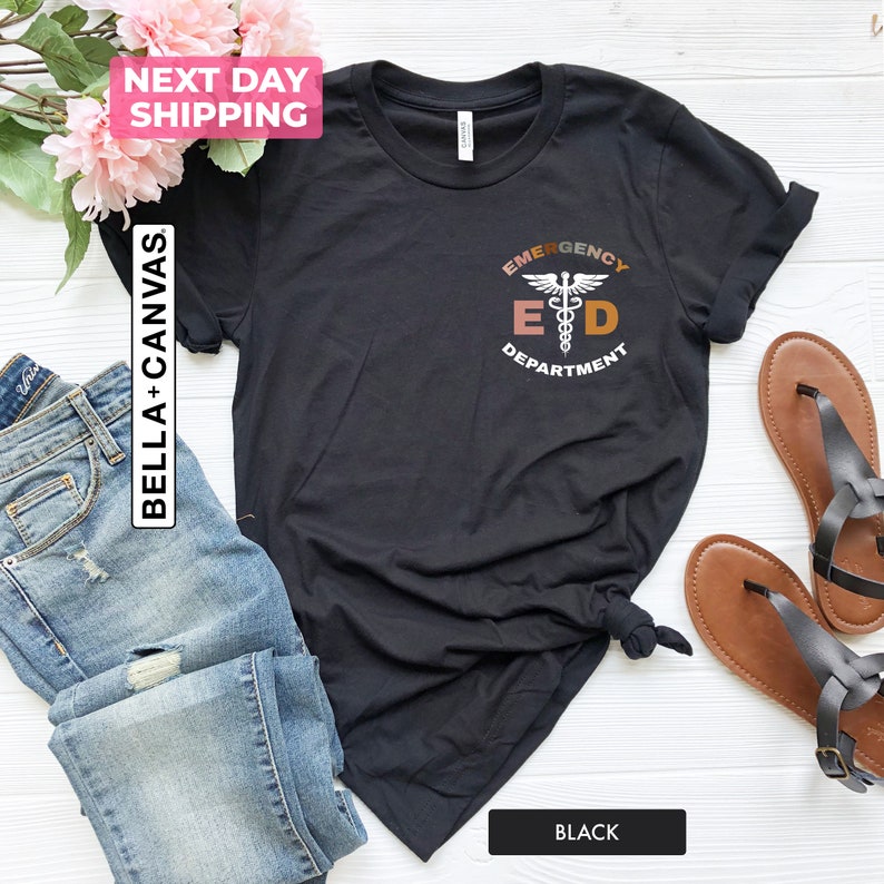 May include: Black t-shirt with a white graphic of a medical symbol and the text "Emergency Department" in a circle.
