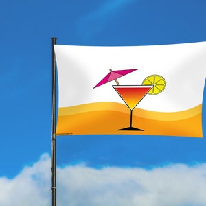 May include: A white flag with a yellow and orange beach scene. A cocktail glass with a pink umbrella and a lemon slice is in the centre of the flag.