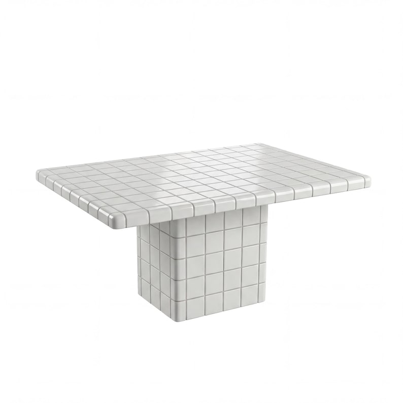 May include: A white, square-topped table with a single, block-shaped base. The table's surface and base are covered in a grid pattern of small, square tiles. The table is a modern design, suitable for various interior settings.