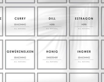 May include: Nine white square labels with black borders and text. The labels are arranged in a 3x3 grid. The text on the labels includes the names of herbs and spices, such as Curry, Dill, Estragon, Gewürznelken, Honig, Ingwer, Kardamom, Kerbel, and Knoblauch. Each label also includes the words "Seasoning" or "Herb" and "All Natural".