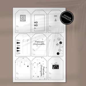 May include: A sheet of white gift tags with black line art designs. The tags feature holiday-themed illustrations, including Christmas trees, ornaments, and the text "Frohe Weihnachten." A digital download label is in the upper right corner.