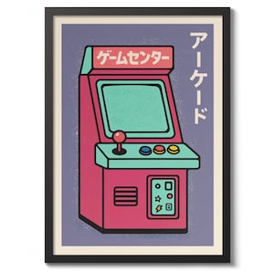 May include: Framed print of a retro arcade game machine illustration. The machine is pink and teal with Japanese text. The print has a purple background and a black frame. The arcade machine has a joystick, buttons, and a screen.