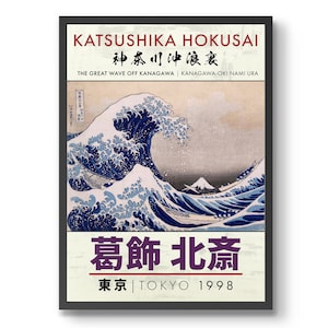 May include: A vintage poster featuring a woodblock print of "The Great Wave off Kanagawa" by Katsushika Hokusai. The poster is in a black frame and has the text "葛飾北斎" (Katsuhika Hokusai) and "東京 | TOKYO 1998" in Japanese and English.