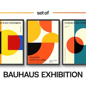 May include: Three Bauhaus exhibition posters with geometric shapes in red, yellow, blue, black, and white. The text on the posters reads "F&uuml;hrend in der Herrenmode" and "Bauhaus Ausstellung".