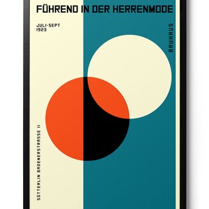 May include: A Bauhaus poster with a geometric design featuring overlapping circles in red, black, and white on a teal background. The text "F&Uuml;HREND IN DER HERRENMODE" is at the top of the poster, and "JULI-SEPT 1923" and "SOTTERLIN BADENERSTRASSE 11" are on the left side. The word "BAUHAUS" is on the right side of the poster.