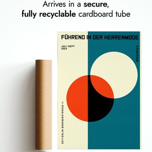 May include: A vintage poster with a Bauhaus design featuring a red, black, and white circle on a teal background. The poster text reads "F&Uuml;HREND IN DER HERRENMODE" and "JULI-SEPT 1923".