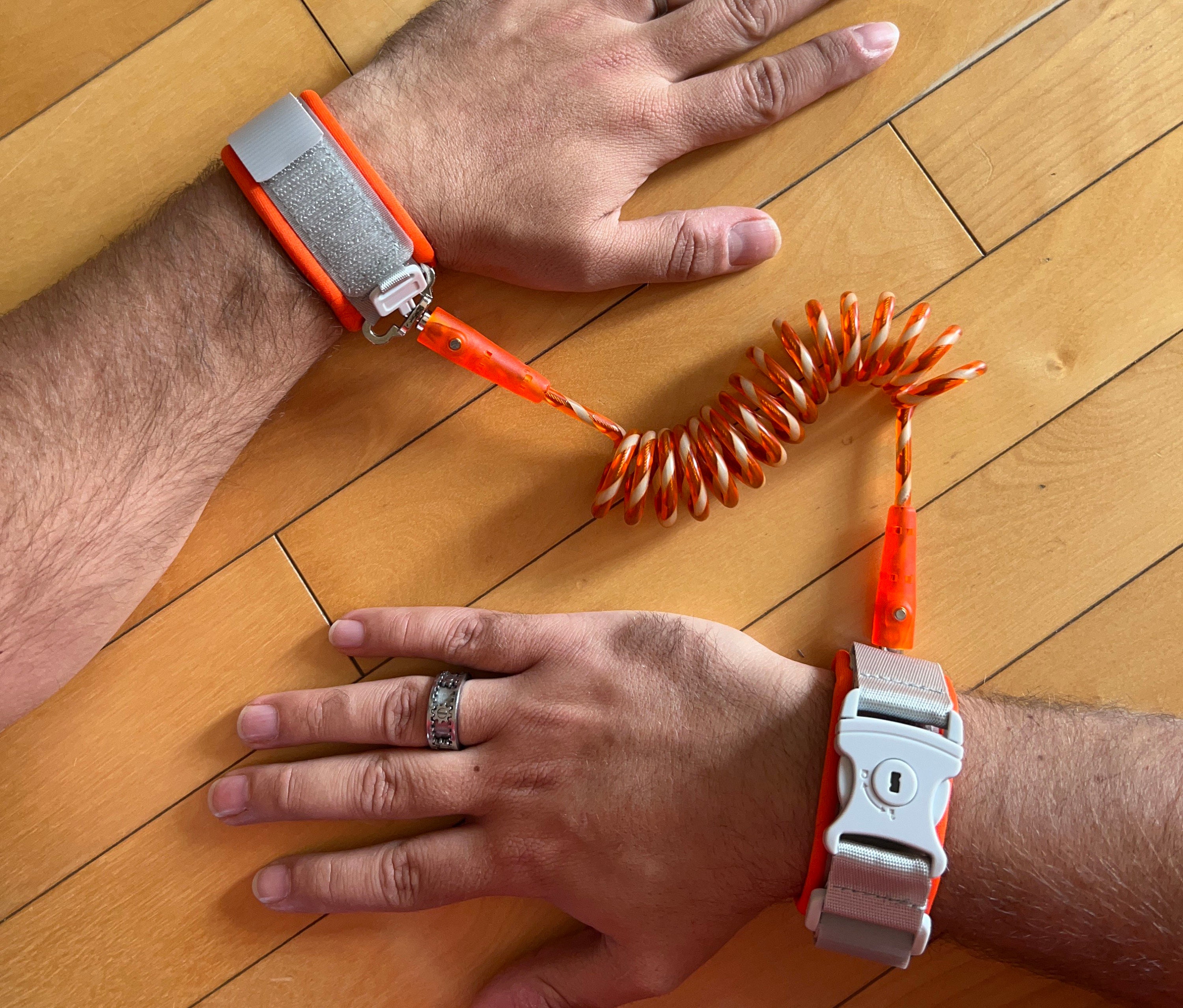 Adult sized coiled wrist leash with LOCKABLE cuff.